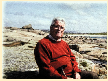 Owen Murphy seated by the shore